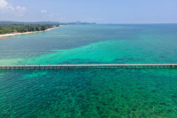 Blue sea with a bridge in the middle of the sea with blue water