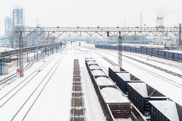 Coal and cargo transportation at railway stations on snowy days