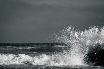 Crashing waves over rocks in the ocean