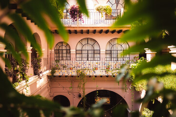 Plants surrounding a courtyard of spanish building