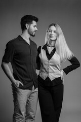 Attractive young couple posing in studio black and white