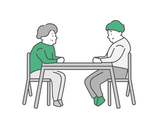 話し合いをする高齢女性と男性介護士