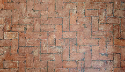 Old Herringbone Brickwork Pattern Texture in a herringbone pattern