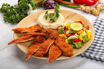 Slices pork schnitzel with vegetables