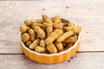 Raw ripe unpeeled peanut heap