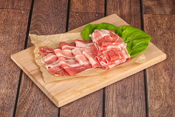 Sliced pork bacon in the bowl