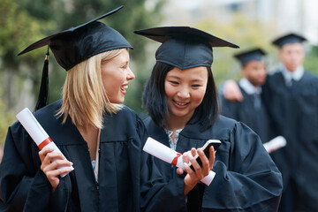 Phone, graduation and students in college or university to celebrate school diploma or degree....