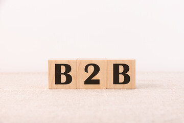 Wooden cubes with the abbreviation B2B on a light background