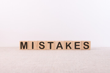 mistakes word concept on cubes on a white background