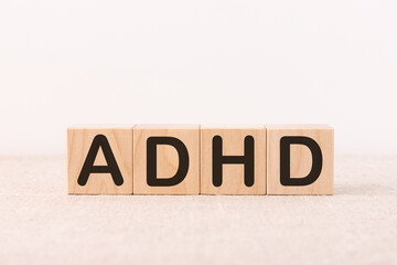 ADHD Abbreviation on ADHD cubes on a light background. Close ADHD - Attention Deficit Hyperactivity Disorder.