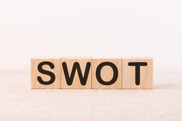 SWOT word made with building blocks on a light background