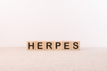 Herpes word concept on wooden cubes and light background