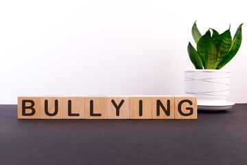 BULLYING word made with building blocks on a light background