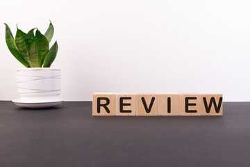 Wooden blocks with the word Review. Customer review concept. Reviewing, auditing, reviewer. Service...