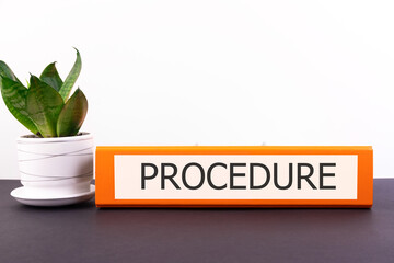 Procedure Office folder on a dark desktop with a flower on a light background