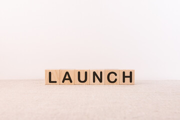 The word launch on wooden cubes and a light background