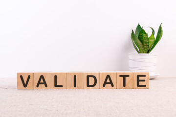 VALIDATE word made with building blocks on a light background