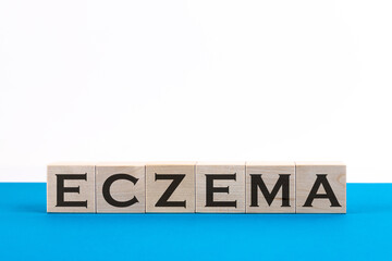 Wooden Blocks with the text Eczema on a blue background