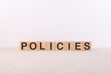 Policies word concept on cubes and white background