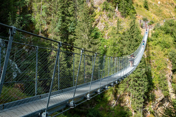 Fototapeta na wymiar Val di Rabbi Valley of the Dolomites famous for its Tibetan bridges and ancient sawmills Alps Italy
