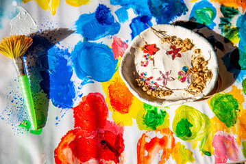 Colourful spots  drawing with paints and a brush, the concept of creativity