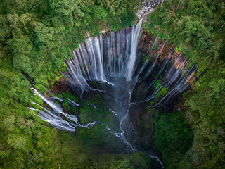 Aerial top view from above of Tumpak Sewu ,also known as Coban Sewu, 120m high waterfall in Malang regency, East Java, Indonesia - 732374127