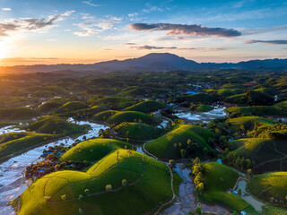 Aerial drone view of sunrise at Long Coc tea field, Phu Tho province, Vietnam - 732374179