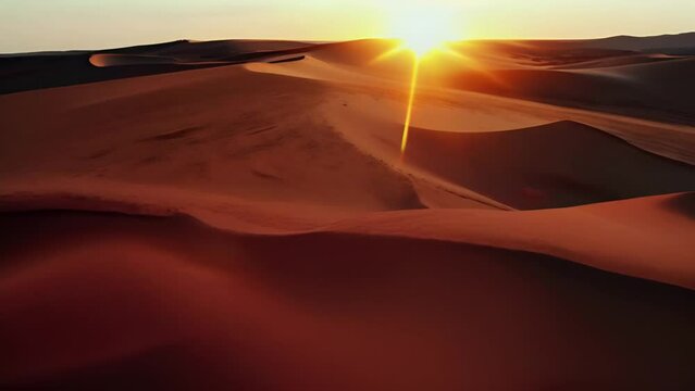 Golden Horizon: A Breathtaking Sunset Over Desert Dunes - evoking a sense of tranquility and awe.