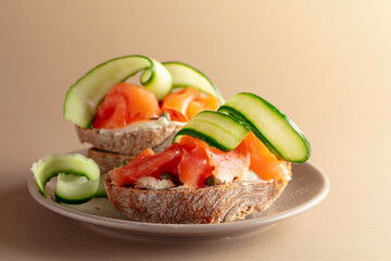 Sandwiches with smoked trout, cream cheese, fresh cucumber and capers.