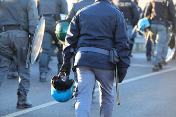 Vicenza, VI, Italy - January 20, 2024: police in riot gear during the protest demonstration with...