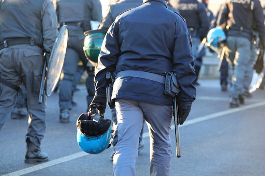 Vicenza, VI, Italy - January 20, 2024: police in riot gear during the protest demonstration with helmets
