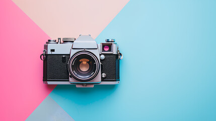 A vintage retro film camera positioned meticulously on a multicolored pastel background - obrazy, fototapety, plakaty