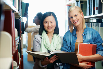 Woman, friends and portrait or book in library or studying for university education, scholarship or knowledge. Female people, face and reading at USA college or literature test, revision or academic