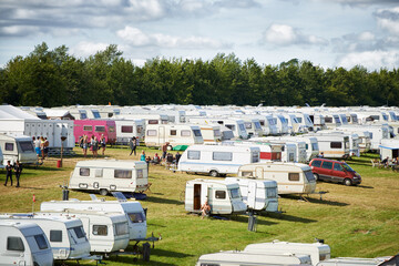 Camping, caravan and outdoor music festival in park for celebration on fun holiday vacation in...
