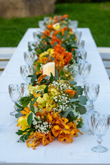 Beautiful flowers decorated on the table.Tables set for an event party or 
wedding reception luxury elegant table setting dinner in a restaurant