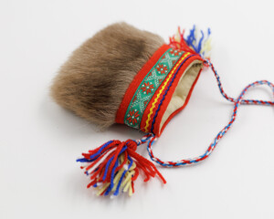 A small traditional Sami bag made of reindeer fur. Side view