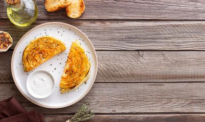 Cabbage steaks with white sauce. Healthy eating. Vegetarian food.