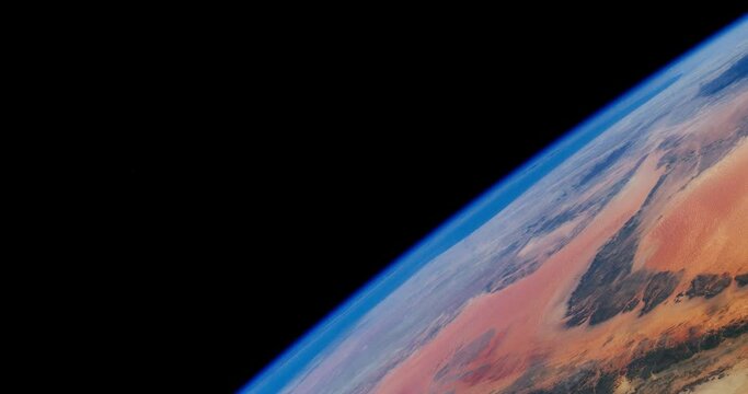 Planet Earth and its atmosphere in motion. Closeup of a deserted land as climate change, global warming or desertification concept. Video based on images by NASA.