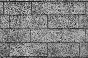 Fototapeta premium Stone block wall fragment. Gray background. High quality photo
