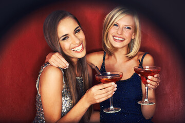 Happy, cocktails and portrait of women at event for party, bonding or happy hour together. Smile, confidence and young female friends with alcohol drinks at night club for celebration and fun.