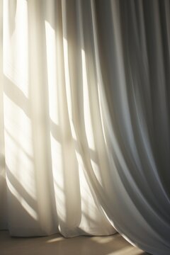 A White Curtain Sitting Next To A Window. Ideal For Interior Design And Home Decor Projects