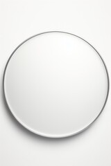 A round mirror hanging on a white wall. Perfect for adding a touch of elegance to any room