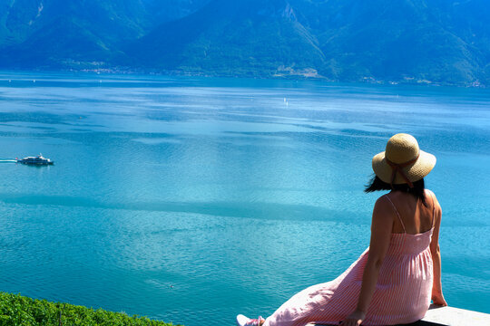 Woman looking at Geneva lake in Switzerland.