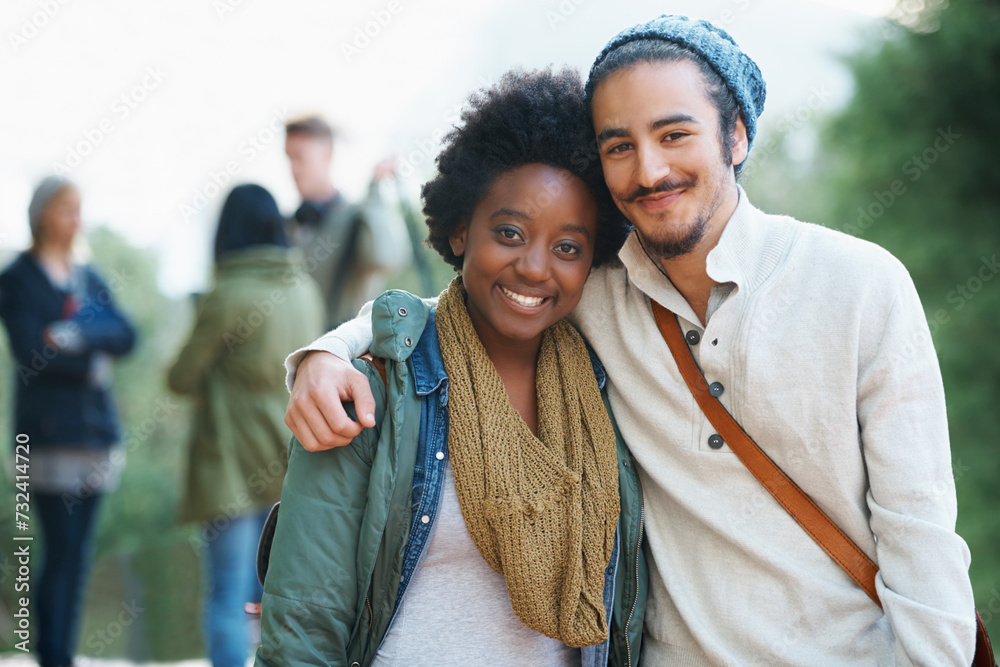 Poster Students, university and portrait of interracial couple of friends on campus with hug and an embrace together outdoor. College, school education and diversity with a happy smile ready for class