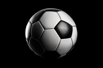 Black and white soccer ball on a black background. Suitable for sports and athletics-related designs