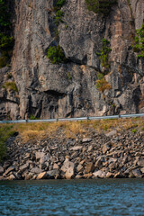 Narrow road built by a steep cliff.