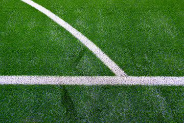 Fototapeta premium White markings of an artificial turf football field.