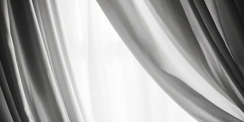 A black and white photo of a curtain. Suitable for interior design projects or adding a touch of elegance to any space