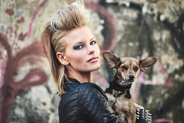 Dog, portrait and punk woman in fashion by graffiti wall and bonding love with chihuahua in city....