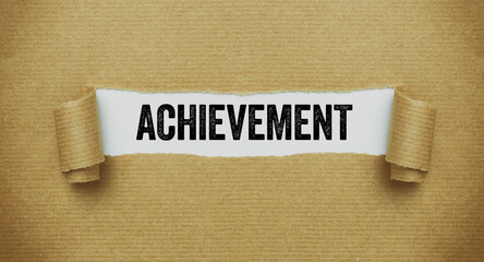 Torn paper revealing the words Achievement